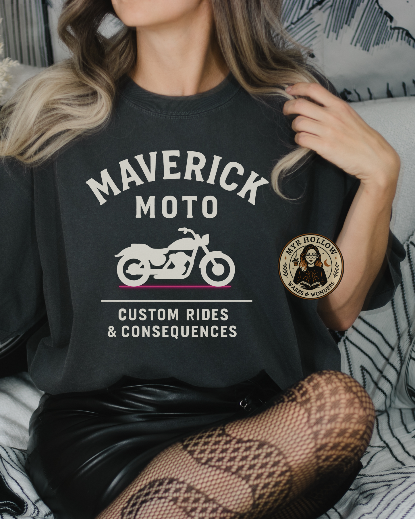 Rook and Rebel inspired biker t-shirt on woman sitting in moody bookish bedroom
