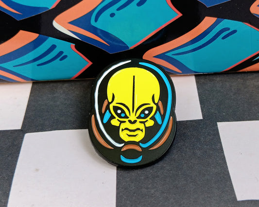 Colorful alien head design on a checkered background