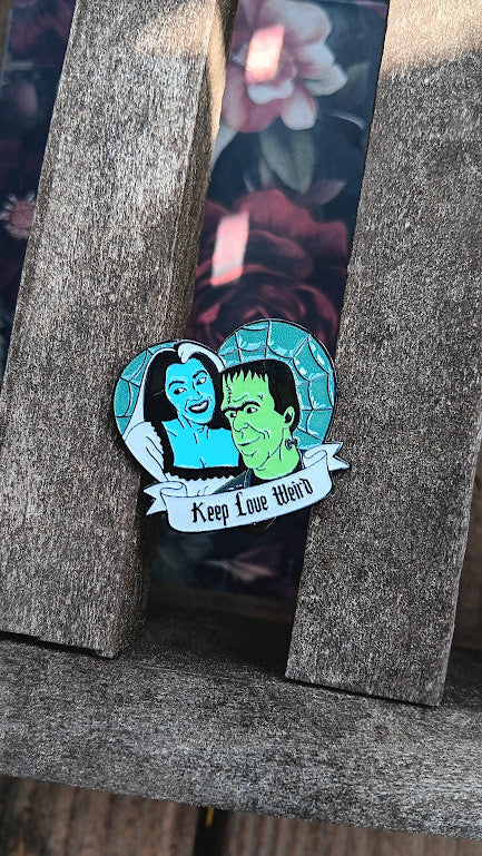 Pin with cartoon characters on a wooden surface