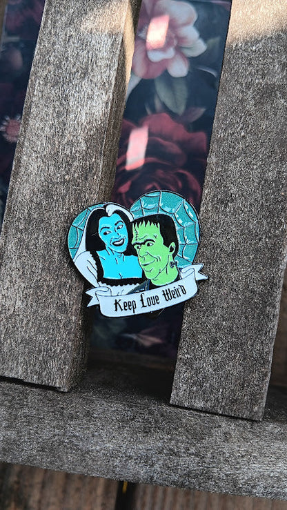 Pin with cartoon characters on a wooden surface